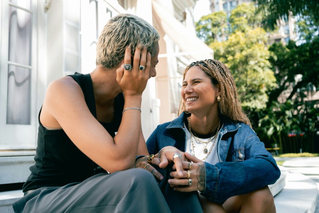 photo of two people talking happily